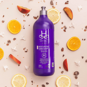Hydra Groomers Moisturizing Conditioner 1L surrounded by natural citrus, peach and oatmeal ingredients – for cats and dogs